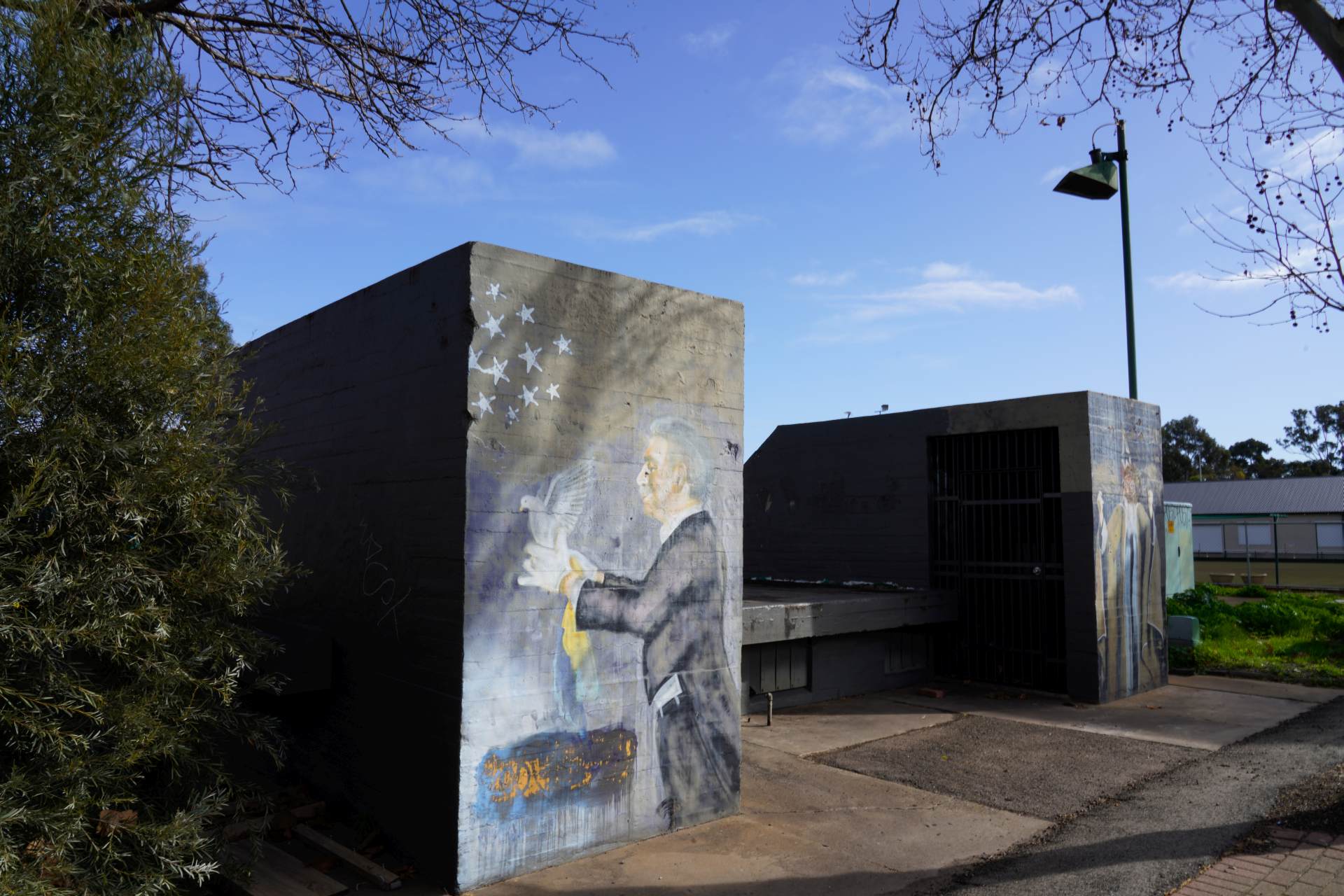 Thebarton Sub-Control Station (WWII Bunker), a concrete structure with a mural of a magician.